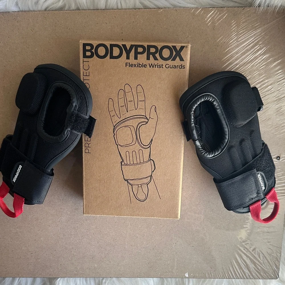 Black Flexible Wrist Guards with Red Pull Tabs